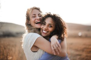 two female intensive outpatient program san diego participants celebrate their recovery