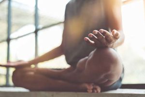 woman doing meditation services