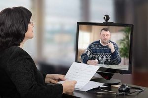 woman meeting with a patient through a telehealth program