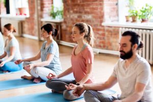 group participating in a yoga therapy program san diego counts on